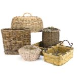 A collection of wicker baskets and food coverings, including an oval wicker food covering with