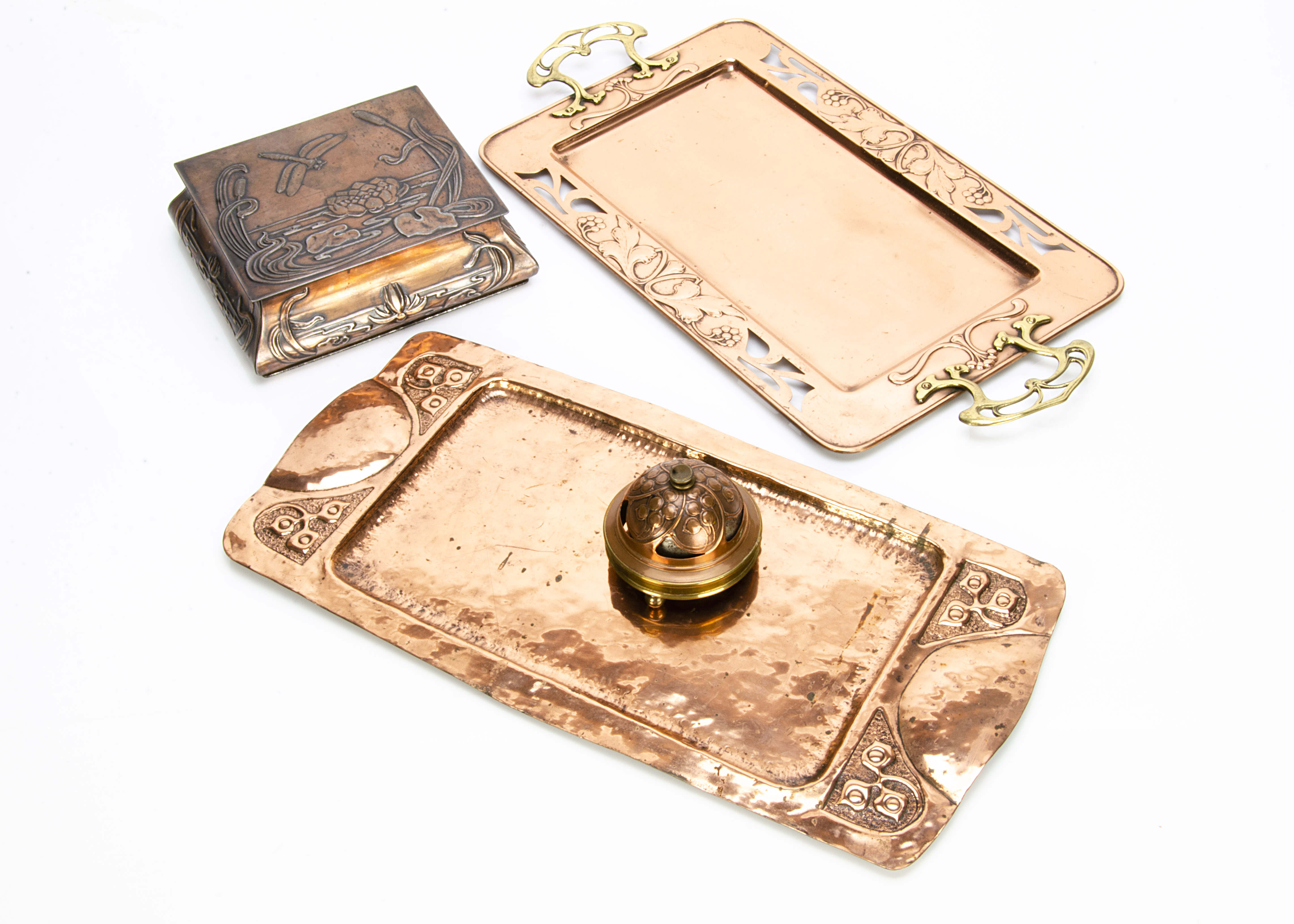A collection of Art Nouveau copper and brassware, including a twin handled rectangular tray, the