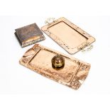 A collection of Art Nouveau copper and brassware, including a twin handled rectangular tray, the