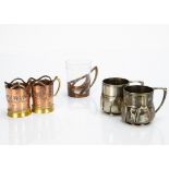 A pair of copper and brass Art Nouveau cup holders, with stamped mark to base CDE either side of