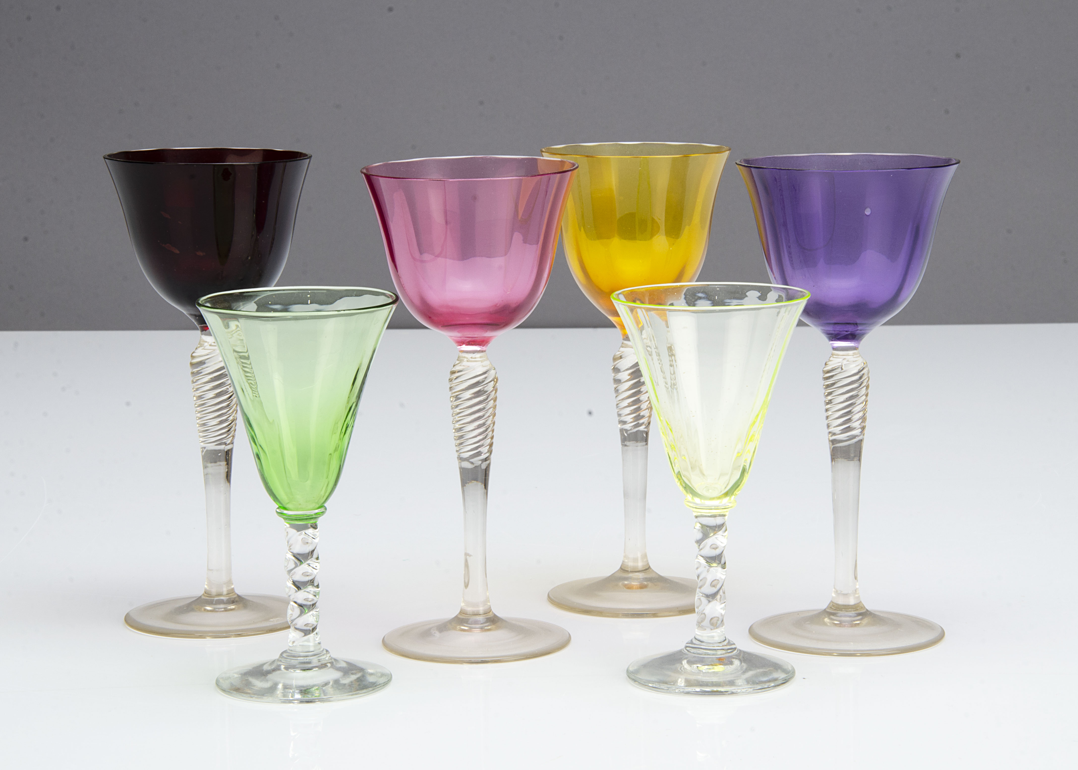 A set of four coloured glass wine glasses, the harlequin glasses with a spiral tapered stem and - Image 2 of 2