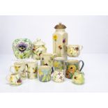 A quantity of contemporary floral decorated ceramics, by Sarah Stoker, including various mugs, jugs,