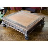 An Indian hardwood and metal mounted square table top stand, with painted red oak centre