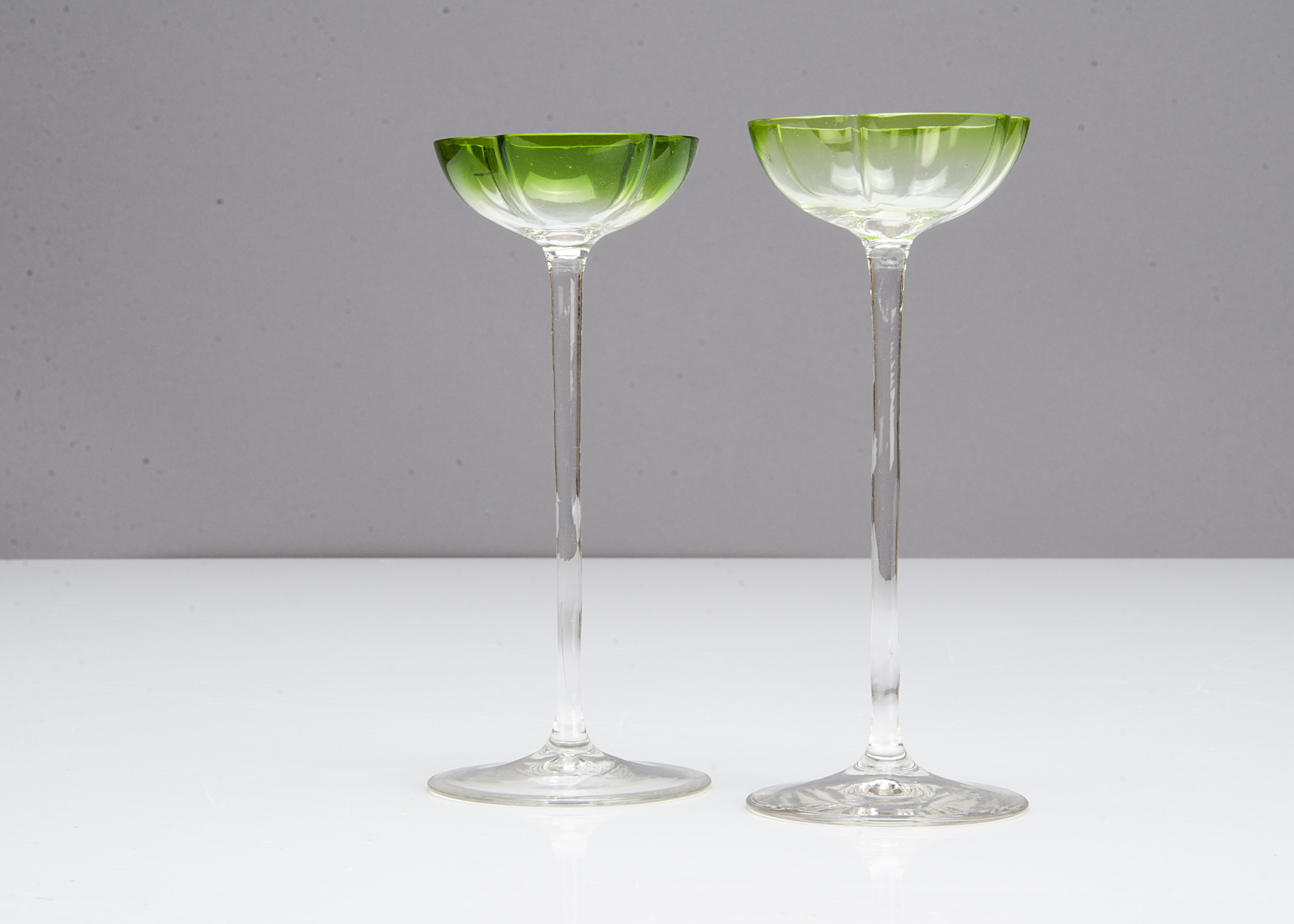 A pair of German Art Nouveau liquor glasses, the shallow quatrefoil green bowls on slender stems and - Image 2 of 2