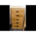 A stripped pine tallboy, the five uniform chest of drawers with anodised metal Art Nouveau handles