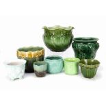 A collection of eight various British pottery and stoneware moulded jardinieres, in green and