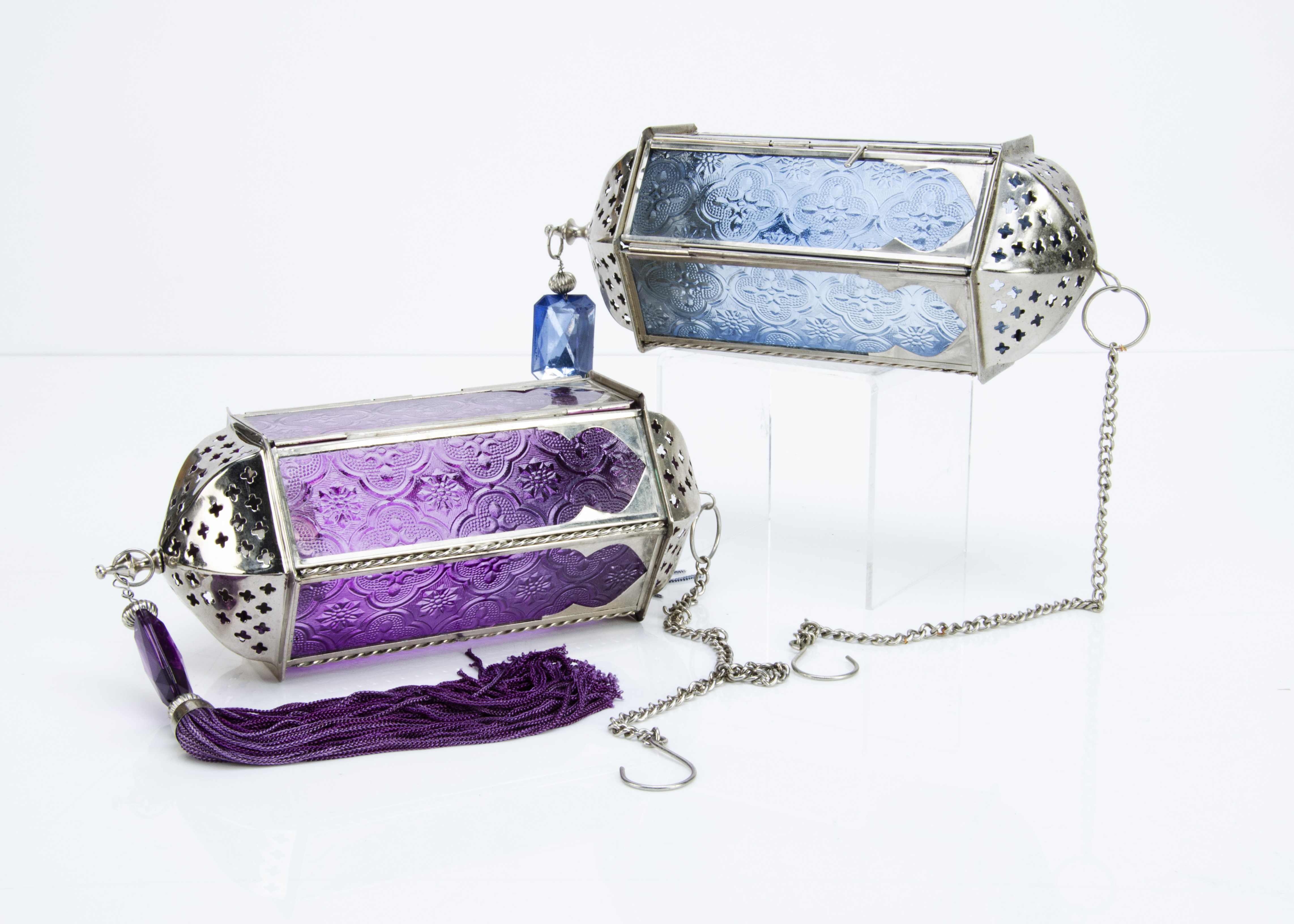 A pair of modern hexagonal chromed metal hanging lanterns, with moulded glass in pink and blue