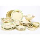 A collection of Clarice Cliff Sundew pattern dinnerware, of banded moulded decoration with floral