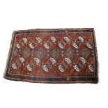 A Middle Eastern Caucasian rug, of rectangular shape with large central panel decorated with two