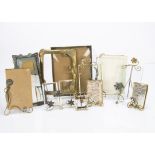 A collection of continental wire work and brass and base metal picture frames, including a pair of