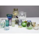 A collection of contemporary glassware, including a painted glass cocktail shaker, various hand