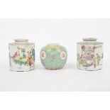 Two Chinese hexagonal famille rose tea caddies and covers, the hexagonal bodies decorated with