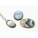 An early 20th Century painted porcelain and silver plated pendant, the oval panel decorated with