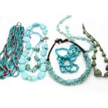 Six various turquoise necklaces, including a multi strand with coral spacers, another large pebble