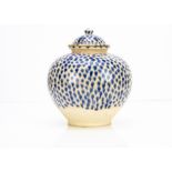 A large continental stoneware jar and cover, of bulbous form with domed lid decorated with a blue