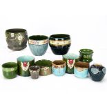 A collection of twelve small Eichwald Art Nouveau German pottery plant pots, jardinières and