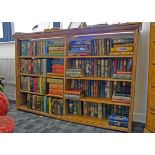 An Edwardian pine three quarter height bookcase, fitted with four shelves in two sections, 159cm