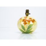 An Art Deco spherical pottery lamp base by Flosmaron, the transfer printed orange pansy against a