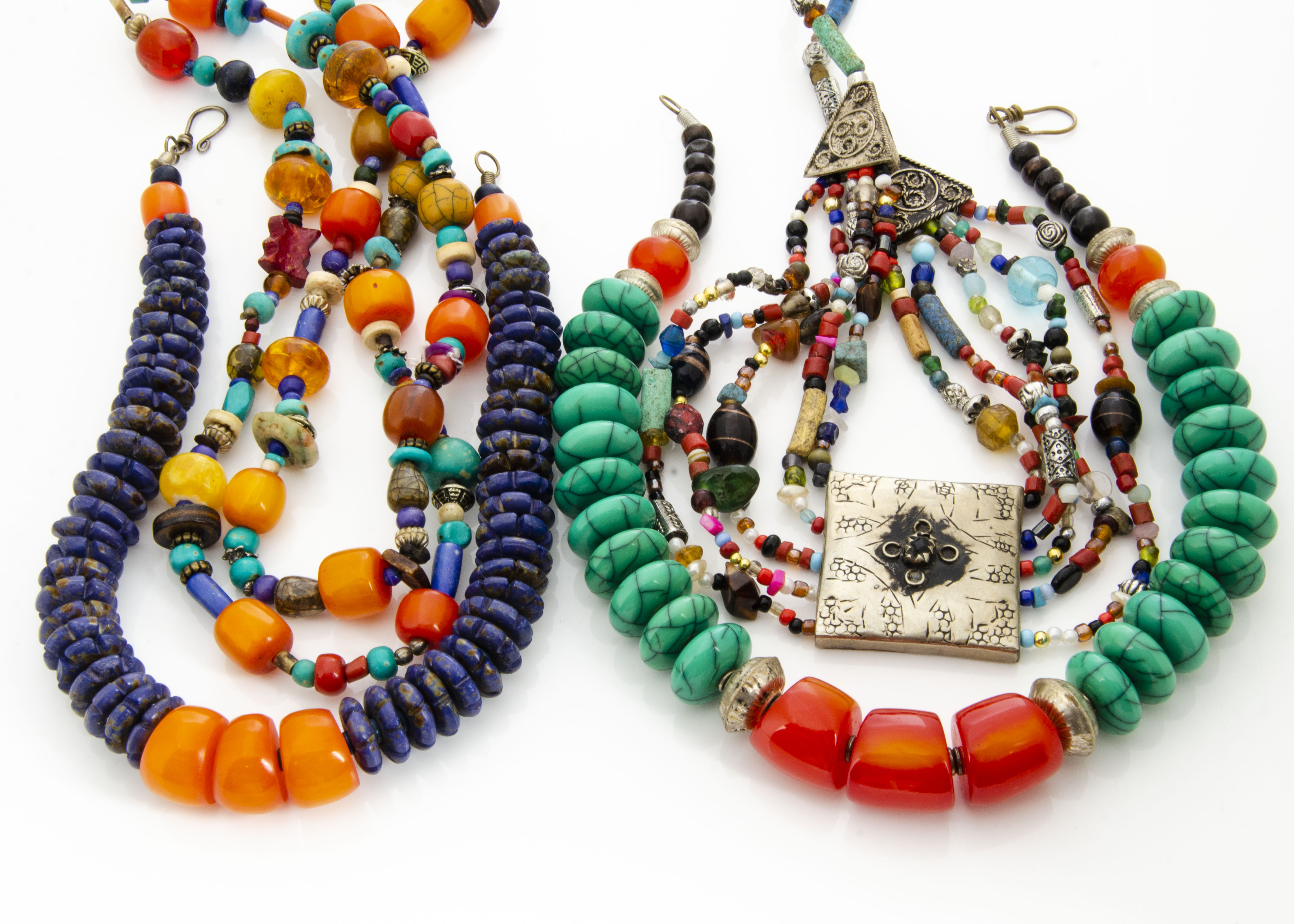 A collection of North African and Middle Eastern coloured bead necklaces, including a white metal - Image 2 of 2