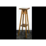 Three Art Nouveau occasional tables, all in oak, two with circular tops both on tripod pierced