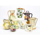 A collection of Art Deco and later jugs, some by Myott & Sons, Wade Heath, all decorated with