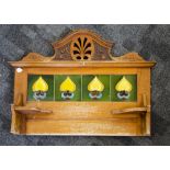 A stained beech and Art Nouveau tile washstand back, the four stylised floral yellow, orange,
