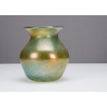 A continental iridescent ovoid vase, with sloping shoulders, waisted neck and splayed rim with an