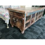 A contemporary North Indian distressed coffer, the hinged top with front frieze decorated with