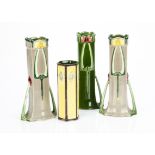 A pair of Eichwald German Art Nouveau pottery twin handled vases, with stylised yellow flower, green