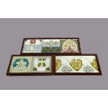 A set of three framed continental Art Nouveau tiles, relief moulded floral decoration glazed in