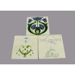 Three Alfred Meakin relief moulded Art Nouveau tiles, all with purple flowers, 15cm square One