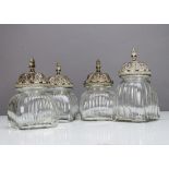 A set of three contemporary glass and resin storage jars, in the Middle Eastern style, the moulded