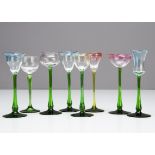 Eight German Art Nouveau green stemmed coloured bowl liquor glasses, each green stem supporting a