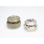 Two continental glass Art Nouveau dressing table jars and covers, one with enamel decoration in