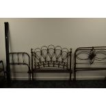 Four iron and brass bedsteads, comprising a painted black and cream single child's bed, 72cm wide,