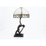 An Art Deco style resin figural lamp base, modelled as a nude female in a kneeling pose with arms