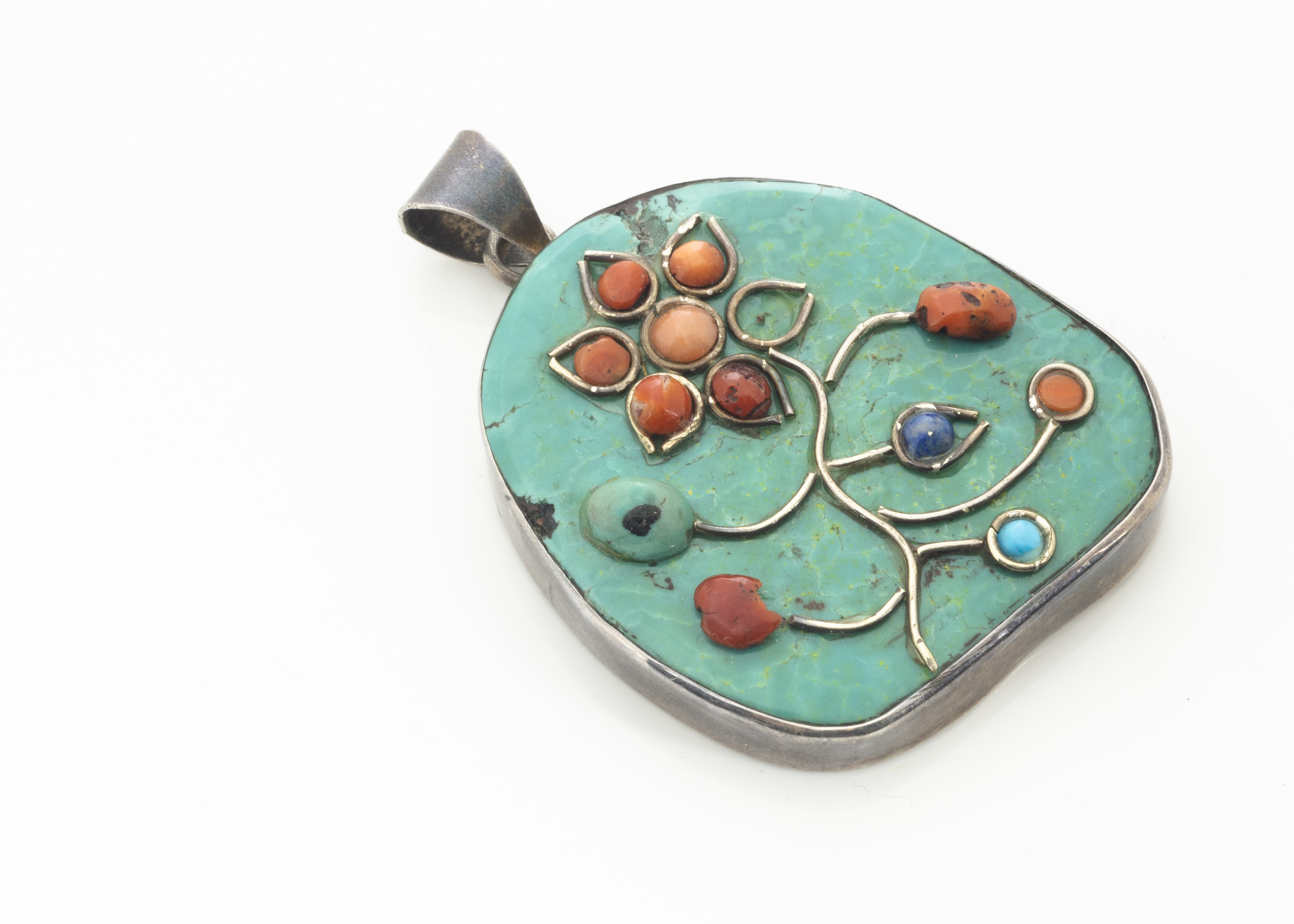 A turquoise, coral and lapis lazuli white metal pendant, of floral design, bale marked 925, 6.2cm