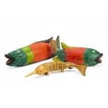 Three Nigerian painted fish, one articulated, longest 46cm (3)