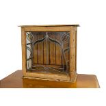 A glazed pine cabinet, the three glazed sides with hinged door with astragal glazed Art Nouveau