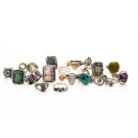 A collection of silver gem set dress rings, including tiger's eye, citrine, turquoise, synthetic