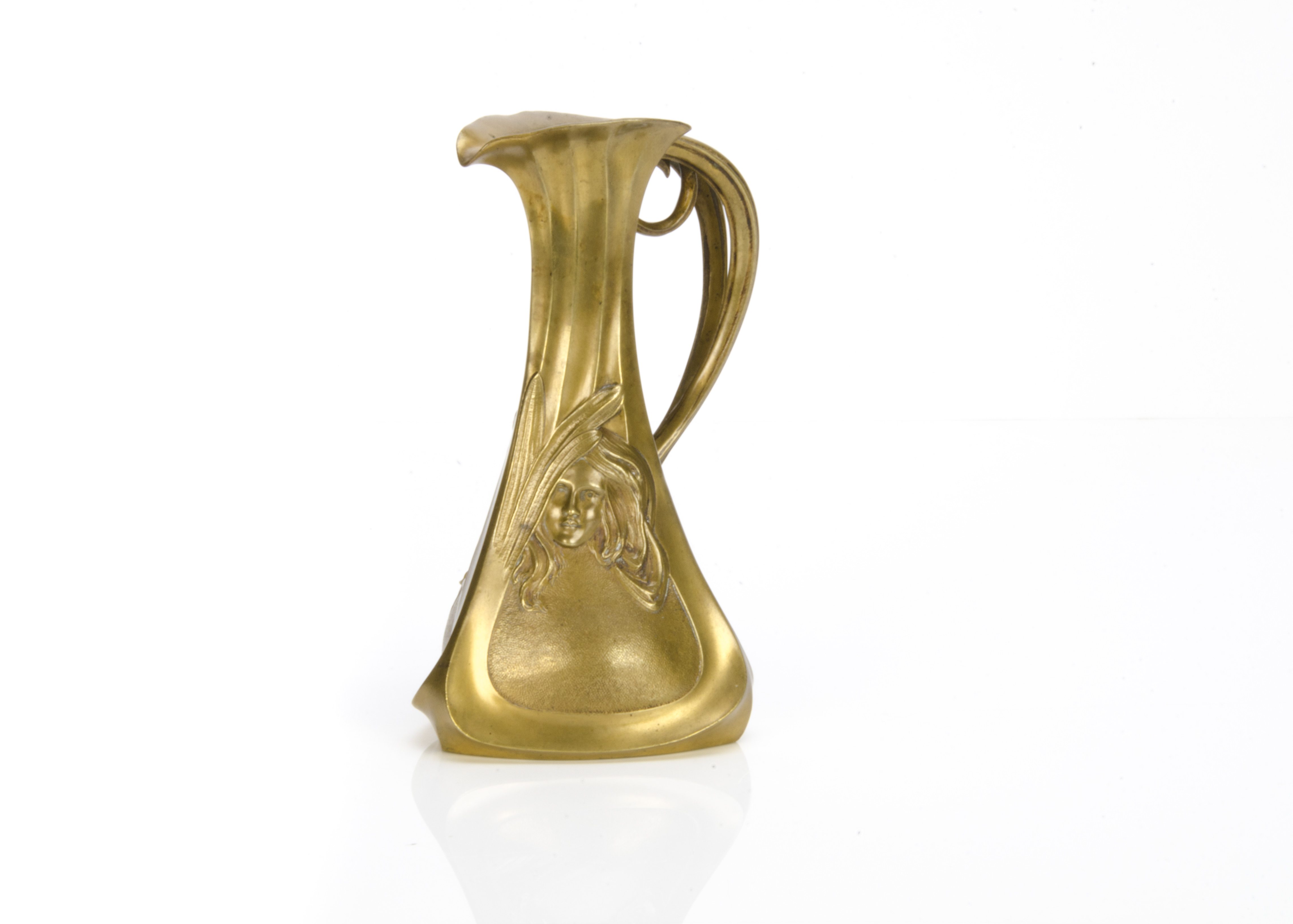 A French bronze Art Nouveau jug or pitcher, of triangular tapered form with the front two sides