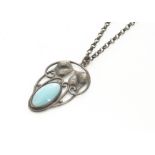 A white metal and turquoise Art Nouveau oval pendant, stylised leaf design centred with oval