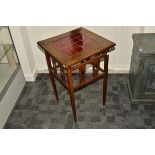 An Arts and Crafts tile top occasional table, the central red tiles surrounded by a large flange