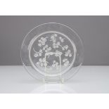 A Rene Lalique salad plate, Muguet pattern, the clear glass circular plate with moulded decoration