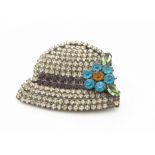 An Art Deco paste set brooch, modelled as a bonnet with floral bow, 6cm x 5cm