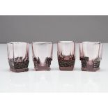 A set of four Art Deco amethyst heavy liquor glasses, of rectangular form with canted corners and