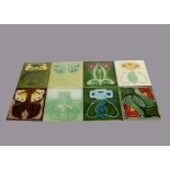 Eight Marsden Art Nouveau relief moulded tiles, floral design painted in colours, 15cm square Some