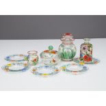 A collection of Art Deco painted floral glass items, including a jar and cover with white and yellow