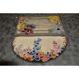 An Art Deco machine made rectangular rug, the rag work style rug decorated with large flowers and