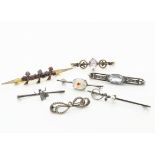 Seven early 20th Century bar brooches, including garnet set gilt metal clover brooch, amethyst and